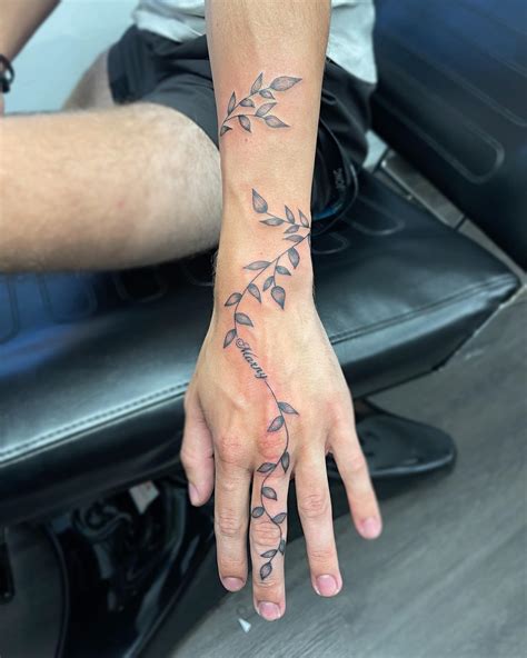 vine hand tattoos|hand vine tattoo for women.